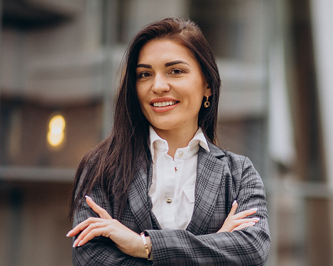 young-business-woman-classy-suit-by-office-center 1